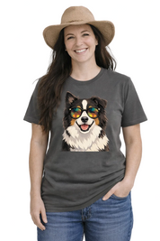 Person wearing a dark gray t-shirt with a dog graphic, sunglasses, and a hat on a white background