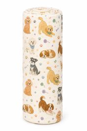 A cylindrical bolster pillow with a cream-colored fabric cover featuring a playful pattern of various dog breeds and paw prints, shown on a plain white background.