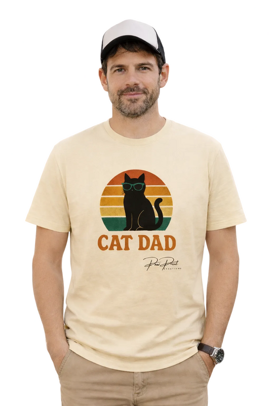 Man wearing a beige t-shirt with 'Cat Dad' graphic and text on a white background