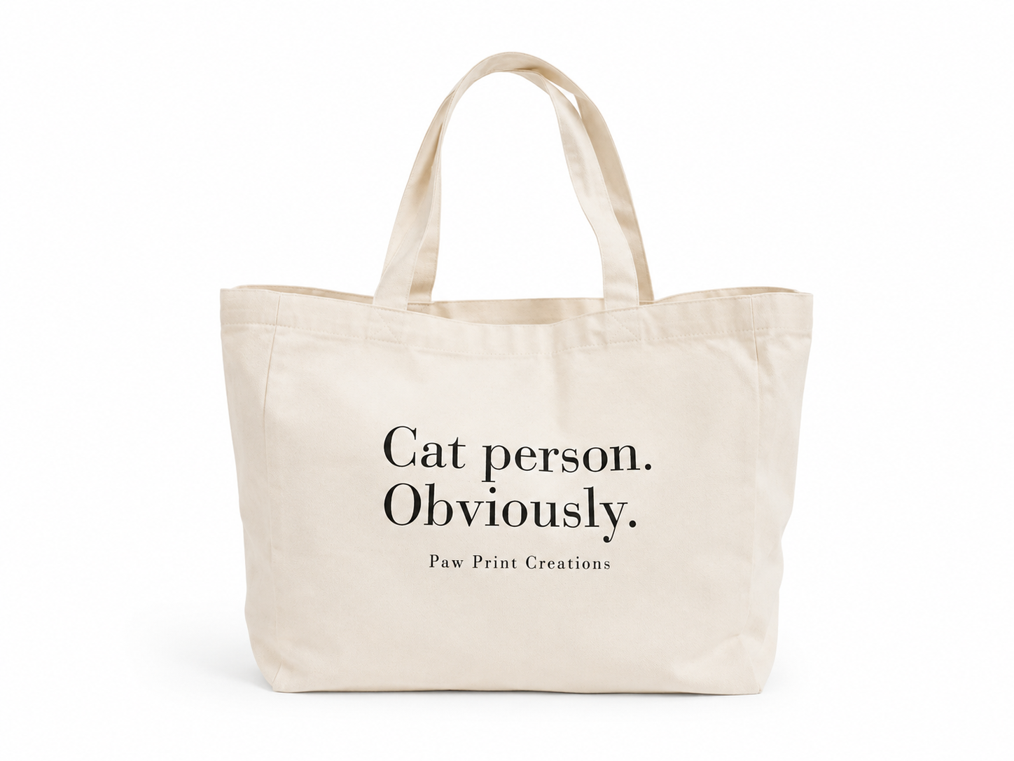A natural canvas tote bag with black printed text reading 'Cat person. Obviously.