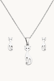 Silver necklace with a cat-shaped pendant, shown with matching stud earrings on a plain white background.