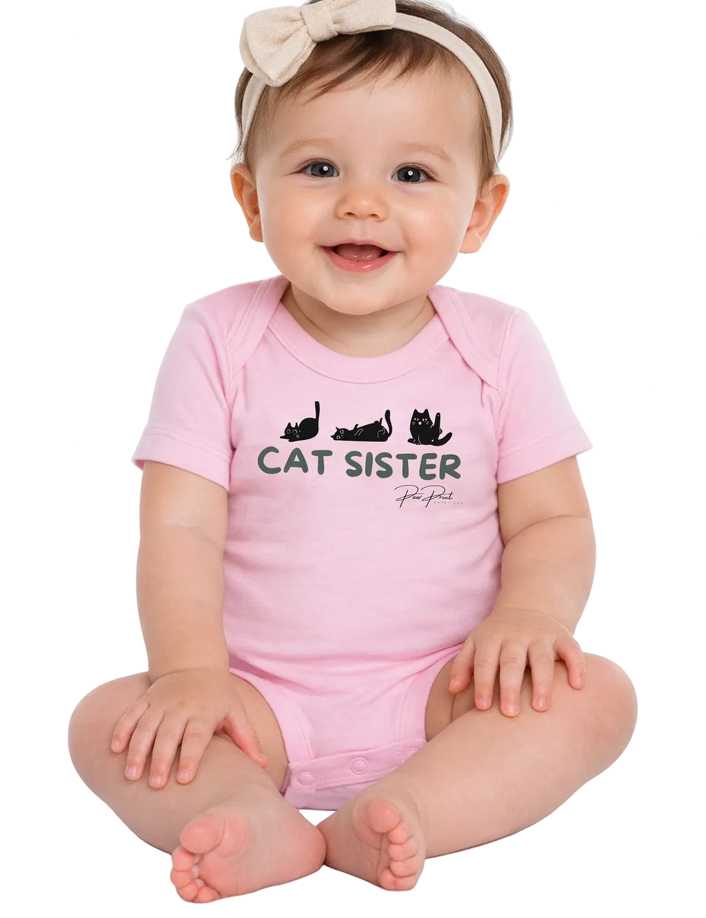 Baby wearing a pink 'Cat Sister' onesie on a white background