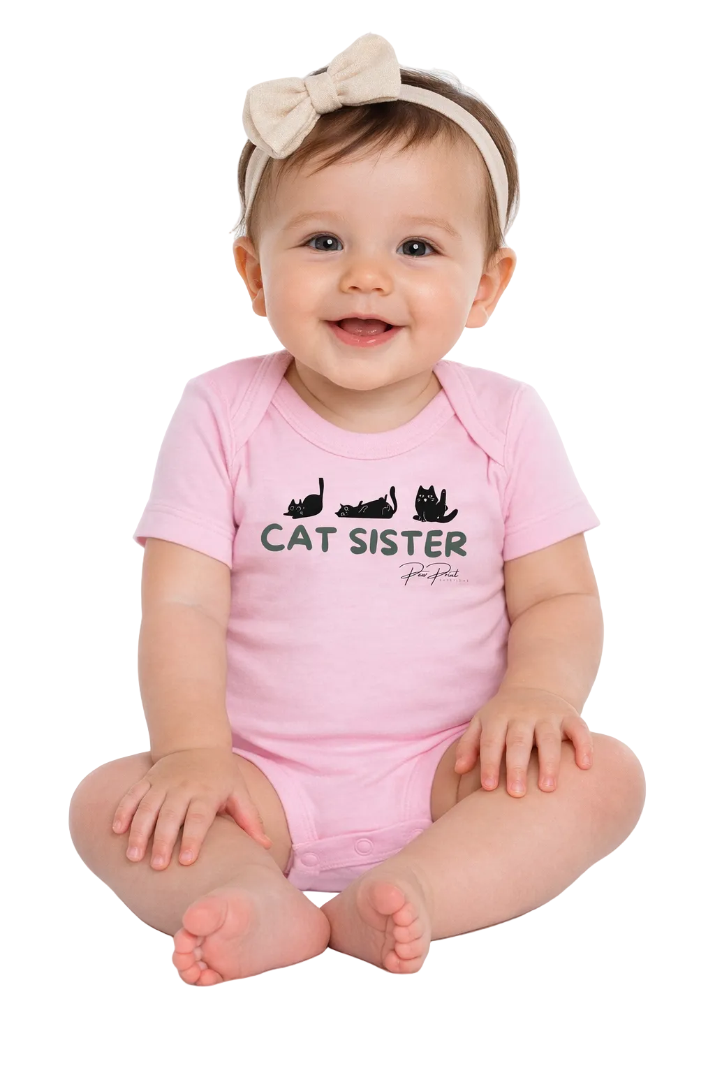 Baby wearing a pink 'Cat Sister' onesie on a white background