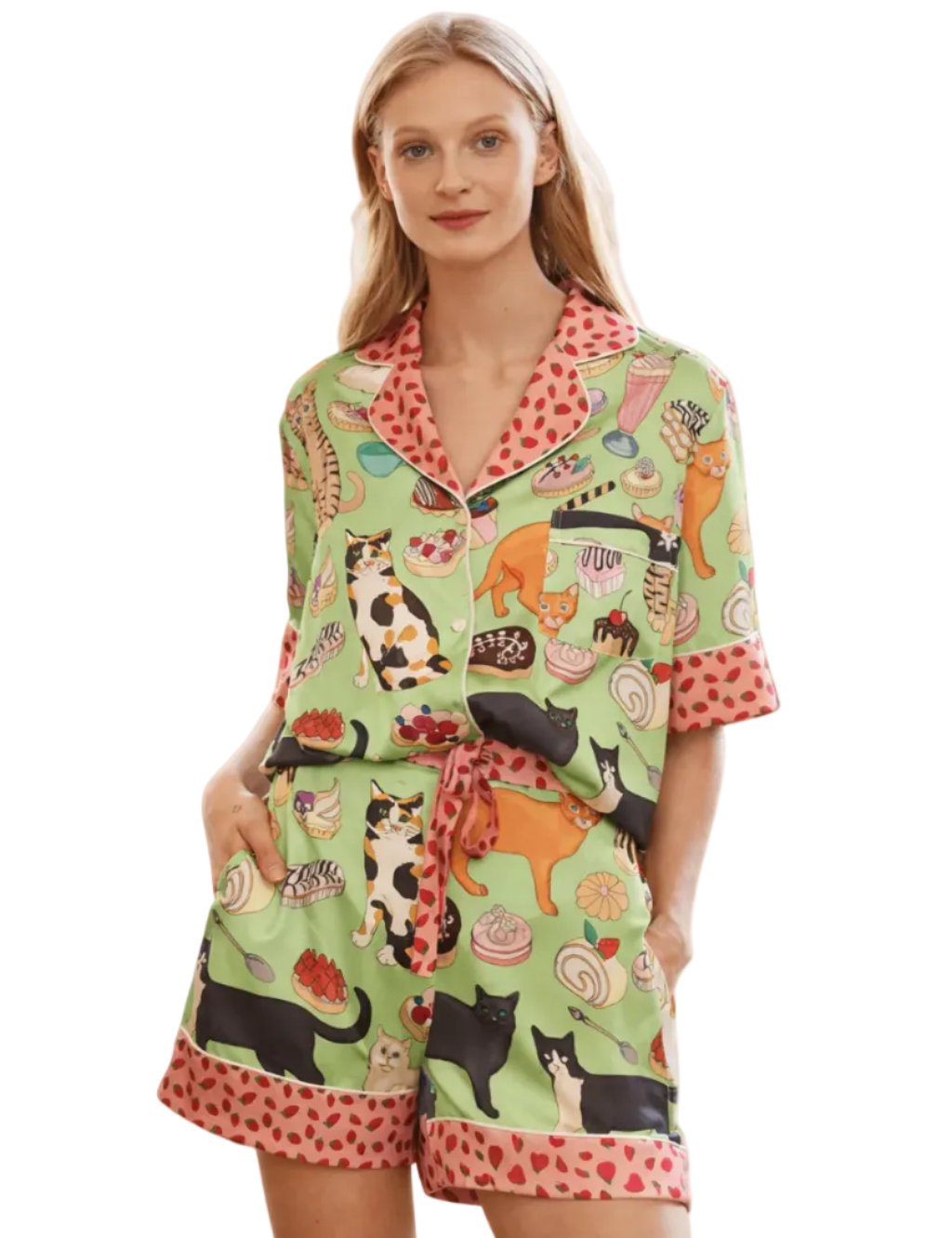 Woman wearing a green pajama set with animal print on a white background