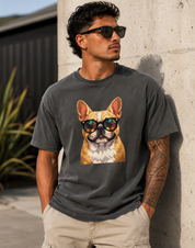Man wearing a t-shirt with a dog graphic and sunglasses against a concrete wall.