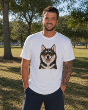 Man wearing a white t-shirt with a dog graphic in sunglasses outdoors.