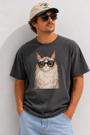 Man wearing a black t-shirt with a cat graphic and sunglasses against a plain background