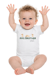 Baby wearing a white onesie with 'DOG BROTHER' text and cartoon dogs, sitting on a white background.
