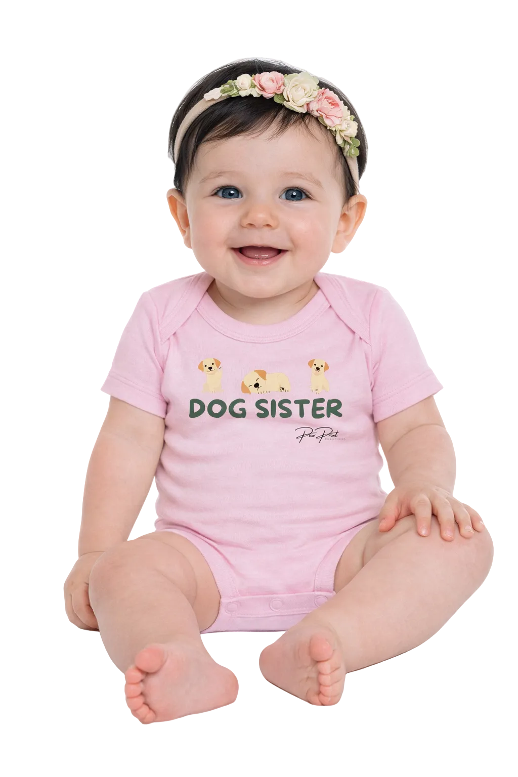 Baby wearing a pink 'Dog Sister' onesie with a floral headband on a white background