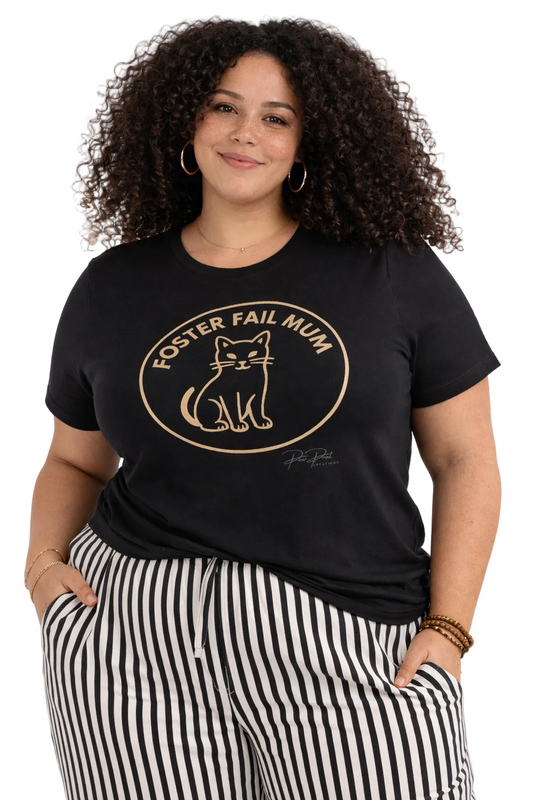 Woman wearing a black t-shirt with 'Foster Fail Mum' text and cat graphic.