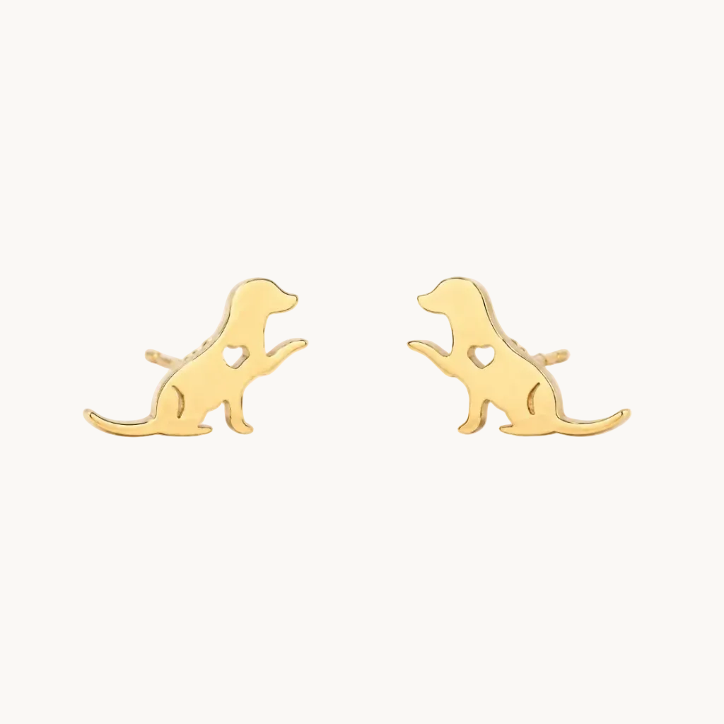 A pair of gold stud earrings shaped like sitting dogs, shown on a plain white background.