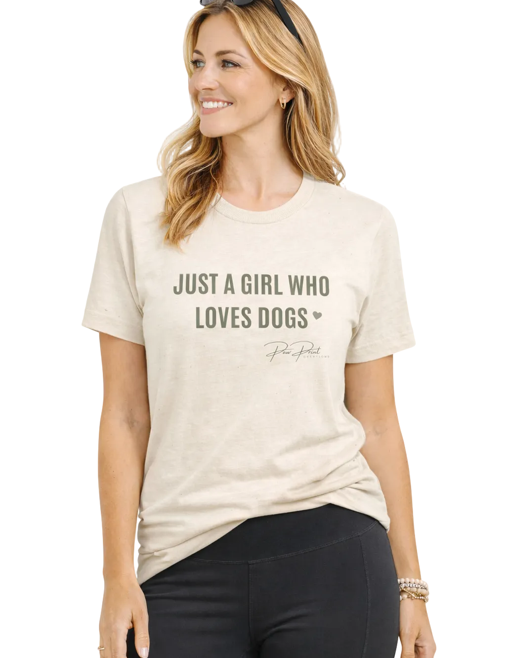 Woman wearing a beige t-shirt with 'Just a Girl Who Loves Dogs' text on a white background