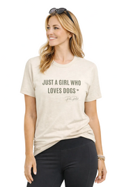 Woman wearing a beige t-shirt with 'Just a Girl Who Loves Dogs' text on a white background