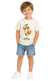 A young boy wearing a cream-colored t-shirt with a cartoon cat graphic and the text 'Whiskers Treasures', paired with blue denim shorts and white sneakers, standing against a plain white background.