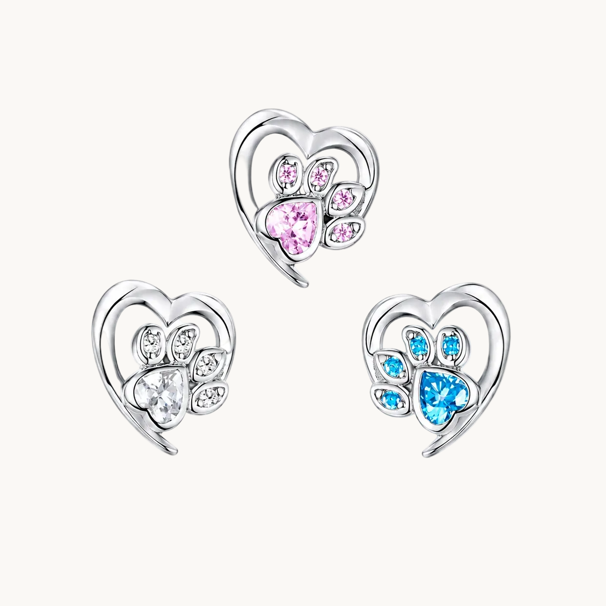 Heart-shaped earrings with gemstones on a white background