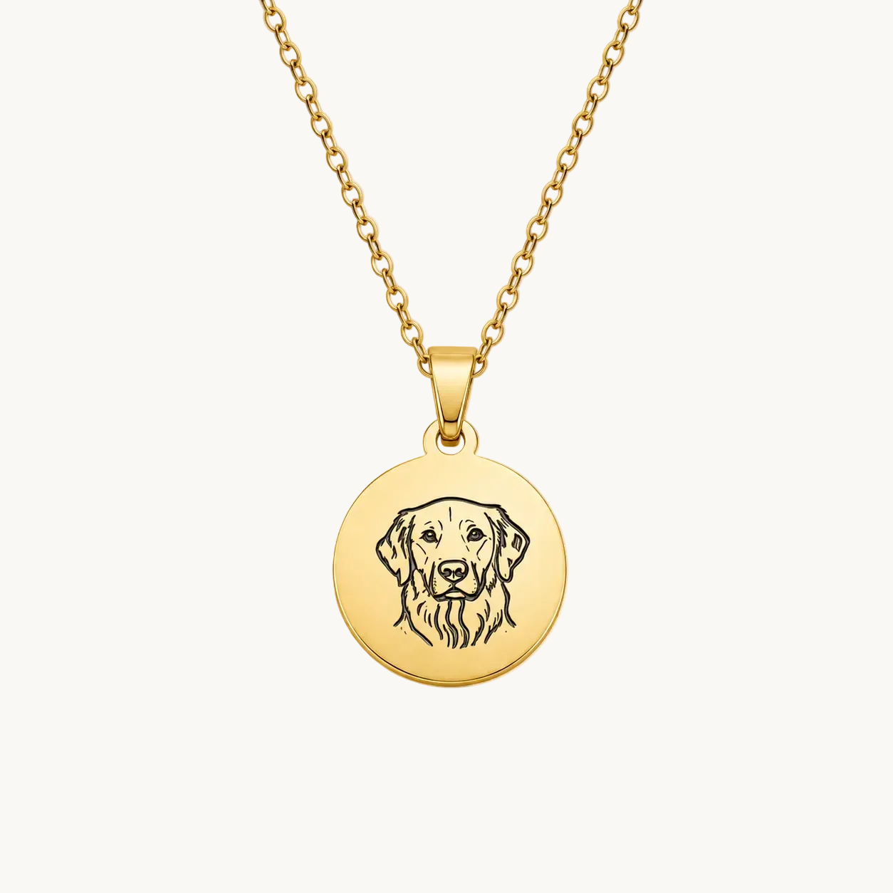 Gold necklace with a round pendant featuring a dog's face on a white background