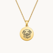 Gold necklace with a round pendant featuring a dog's face on a white background
