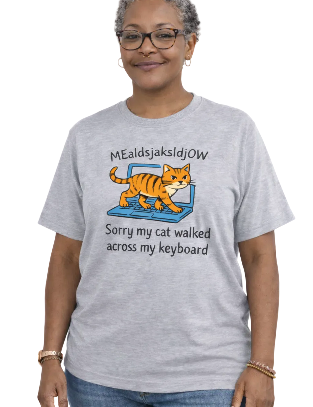Person wearing a gray t-shirt with a cat graphic and text on a white background