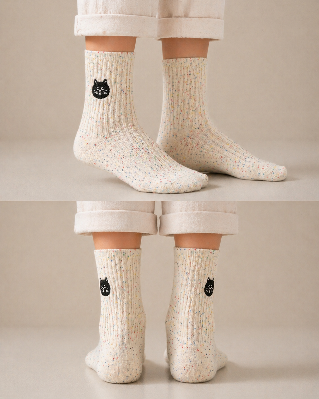 Person wearing white socks with black cat designs on a neutral background